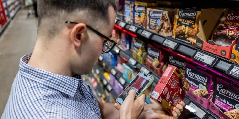 Man scanning a product using FoodSwitch app