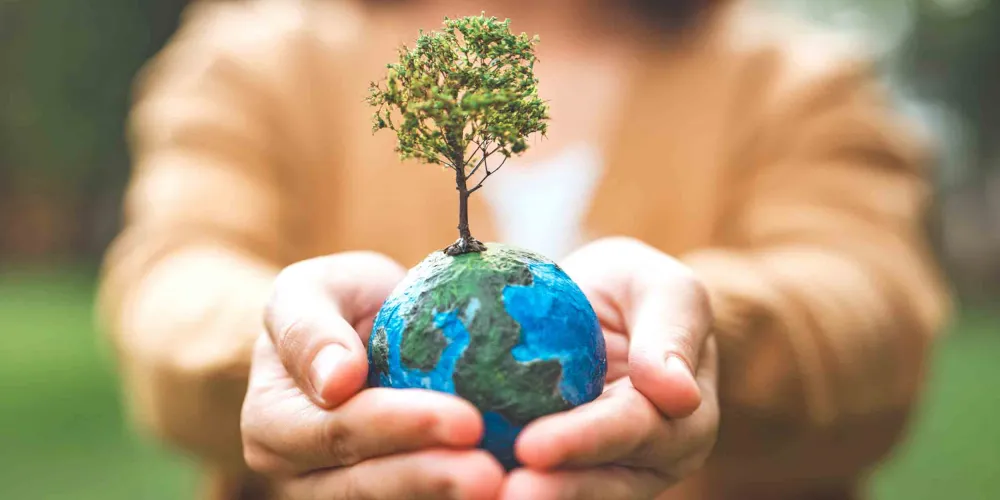 Girl holding planet earth